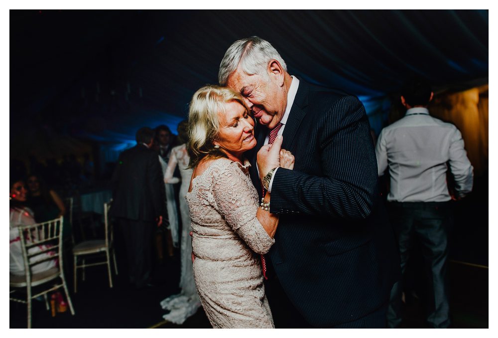Tender moment between older couple dancing
