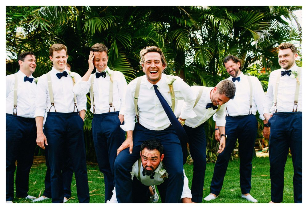 Groom and groomsmen having fun at wedding in Mexico