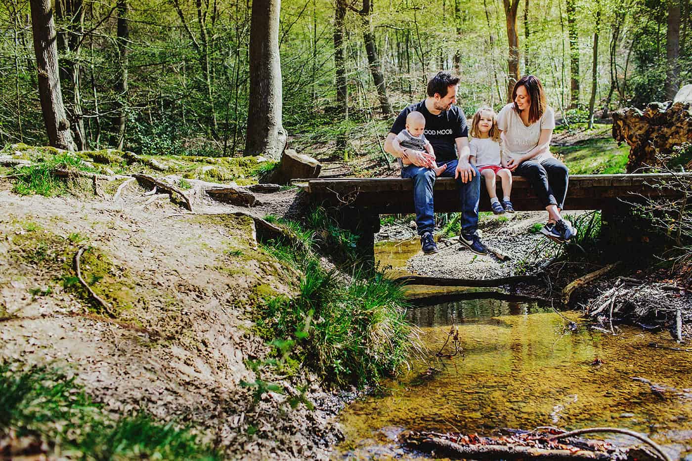 Family portrait on bride over stream