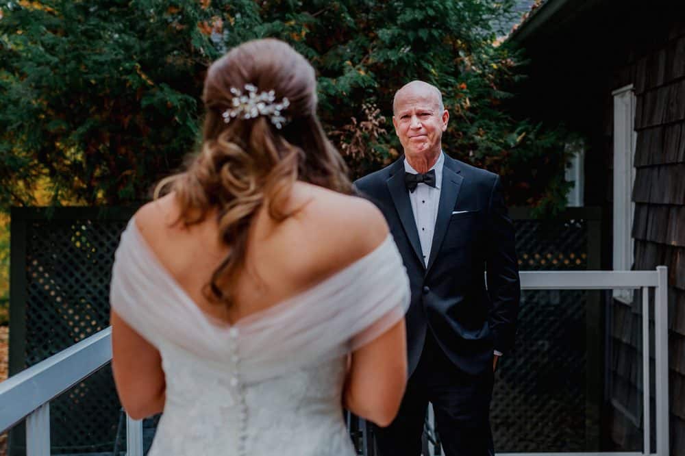 A father sees his daughter in her wedding dress