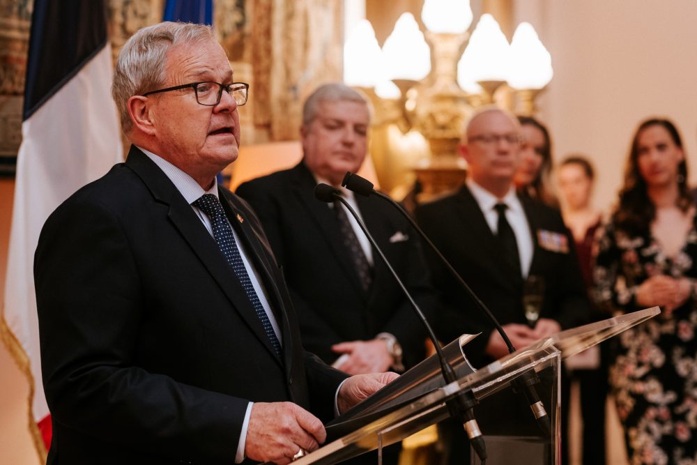 A public speaker talking at an event.