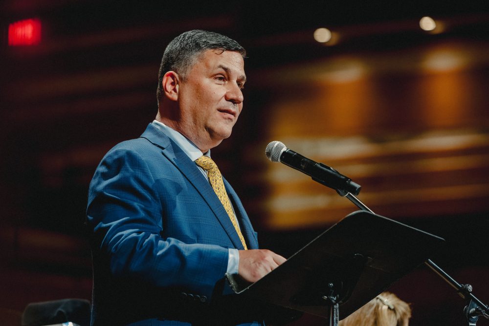 A man speaking into a microphone.