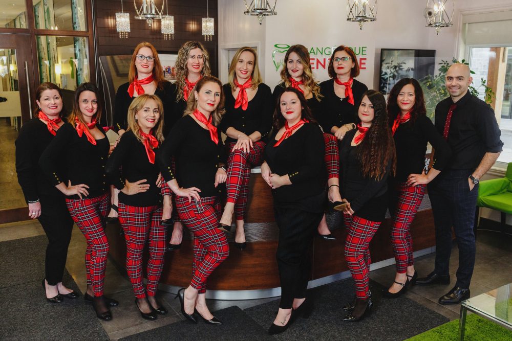 A group of people posing for a branding photoshoot with Steve Gerrard.