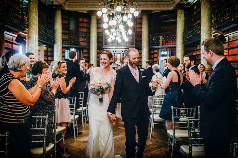 Couple celebrate as they walk down the aisle